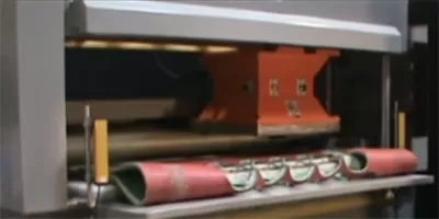 die cutting with conveyor beam press